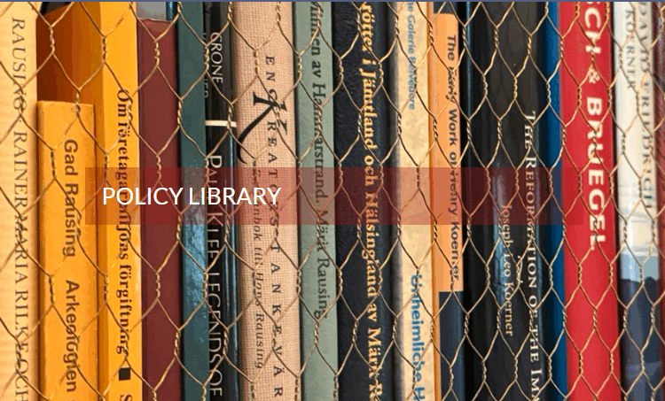 Books behind chicken wire with policy library written over