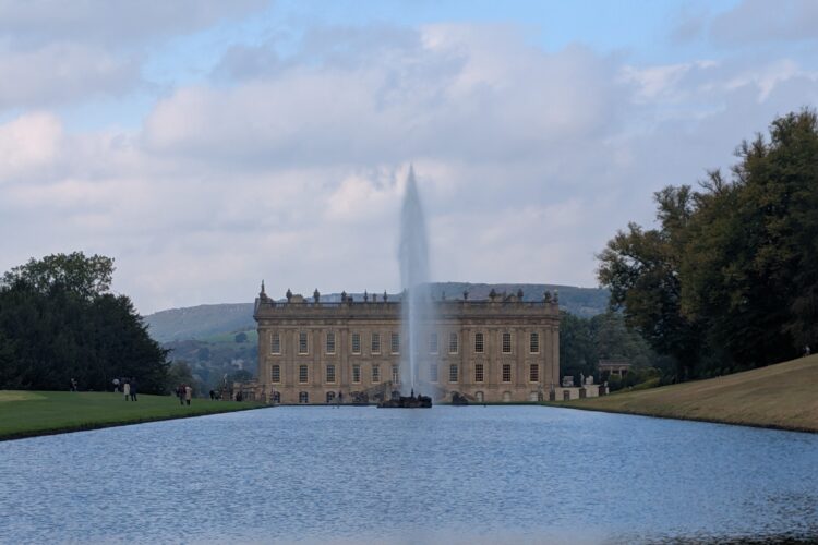 Chatsworth House viewed from the Canal Pond, with the Emperor Fountain visible in front of the house